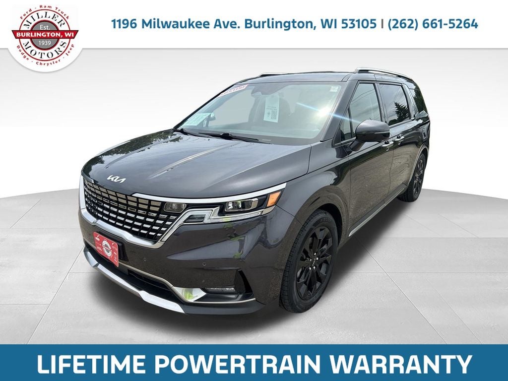 2024 Kia Carnival SX Prestige in Panthera Metal — front three-quarter view